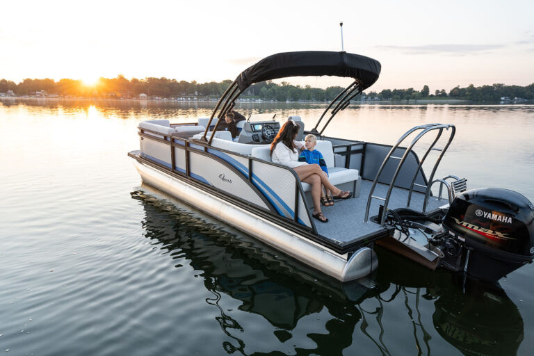 Qwest Pontoons E-Class Lanai features comfortable seating throughout with benches in the front and a rear facing bench on the open back deck.