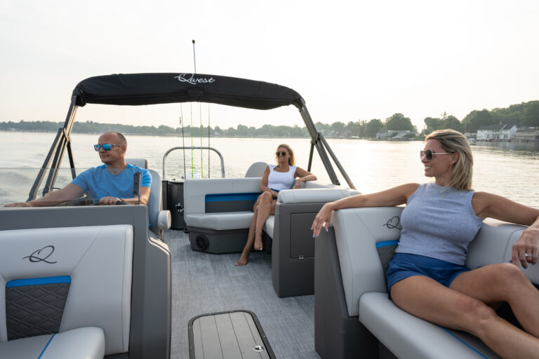 Qwest Pontoons E-Class XRE Cruise model features comfortable bench seating in the bow and rear fishing seats with fish station.