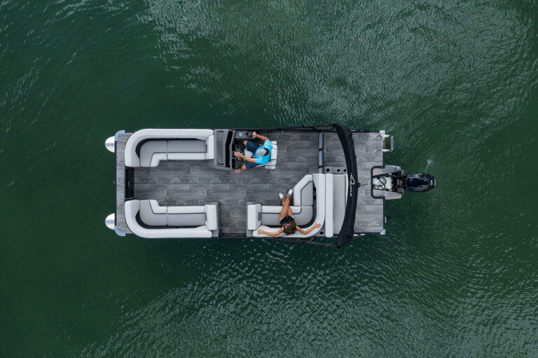 Qwest Pontoons L-Class Lanai features comfortable seating throughout with benches in the front and a rear facing bench on the open back deck.