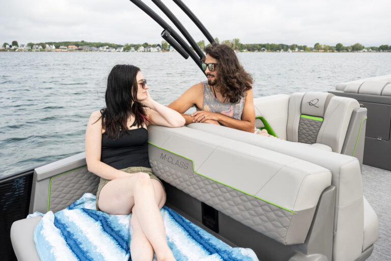 Qwest Pontoons M-Class Lanai features comfortable seating throughout with benches in the front and a rear facing bench on the open back deck.